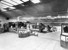 View: s35889 Interior of Brightside and Carbrook Cooperative Society, Castle House (No.1) department store, Angel Street showing the view down the central aisle with ladies costumes and millinery (immediate left)