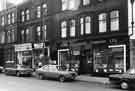 View: s38549 Nos.232-238 London Road showing (right to left) Pearl Assurance Co.Ltd, insurance brokers; Focus Sale and Exchange (No.236) and Beauchief School of Motoring (No.238)