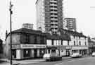 View: s38563 Nos.96-114 London Road at the corner of Randall Street showing (left to right) Rayners Discount Furniture (Nos.112-114); South Yorkshire Stationers (No.108); Romneys Cleaners Ltd, dryers and cleaners (Nos.100-104) and The Pheasant Inn (Nos.96-98)