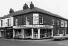 View: s38571 Nos.153-159 London Road at corner of Bennett Street showing B. M. Greaves, china dealers (No.157-159); Stereomobile, car radio installers (No.155) and Abbey Glen Laundry Co.Ltd, laundry and dry cleaners (No.153)