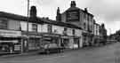 View: s38577 Nos.113-119 London Road showing (left to right) R. Heath and Co., Ltd., confectioners (Nos.113-115); Eric H. Sims Ltd., coach operators (Nos.117-119) and No. 123 The Barrel Inn 