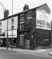 View: s38582 Nos.81-85 London Road showing (left to right) J. Minott, jewellers (No.81) and Sewing Machine Centre, sewing machine agents and dealers (No.83)