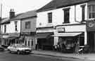 View: s38622 Shops on London Road, Highfield showing (right to left) Local Trading Company, upholsterers sundries (No.207); Sayer's (No.205); the Curry Centre (No.203); Yun Stores Ltd, butchers (No.201) and T. and B. Arnold, bakers and confectioners (No. 199)