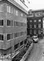 View: s39196 Construction of St. Peter's House, corner of Hartshead and Meetinghouse Lane, showing Victoria Chambers building (right)