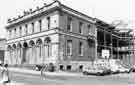 View: s39261 Sheffield Water Works Company offices, corner of Holly Street and Division Street, later became Transport Offices (known as Cambridge House) showing construction of NUM HQ extension