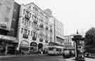 View: s40616 White Building, Fitzalan Square showing shops (l.to r.) J. W. Bradshaw and Son (Sheffield) Ltd , fruiterers; Colonnade, insurance brokers; Klick photopoint and Smiths cleaners