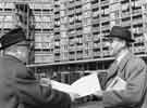 View: s40810 Mr W. L. Cloonie, deputy city architect, (left) shows a copy of the plans of Park Hill Flats to Mr Panayiotis Toumazis, one of a group of visiting Cypriot parliamentarians