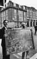 View: s41414 Jo Scarborough presents his painting to South Yorkshire Fire Service outside the Division Street fire station (background)