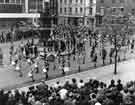 View: s41427 St. George's Day Parade in Barkers Pool showing (background r.to l.) Smith, Widdowson and Eadem, builders and ironmongers, No.8 Cambridge Street; A.Seaman and Sons, photographers (No.6) and the Albert public house (Nos. 2 - 4)