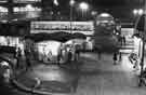 View: s41844 Night view of Pond Street Bus Station and newspaper kiosk