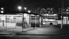 View: s41846 Night view of Pond Street Bus Station showing lights of Park Hill Flats behind