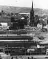 View: s42378 View of Pond Street bus station and the College of Commerce and Technology showing (top left) Lyceum Theatre and (top right) St. Marie's RC Cathedral