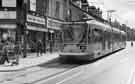 View: s42383 Supertram No.24 at Langsett Road, Hillsborough Supertram stop showing (left) No. 558, Little Lady Little Man and 556, L. Newman, paints and wallpapers 