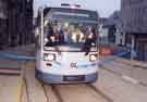 View: s42402 Supertram No.1 going through the opening tape on Commercial Street