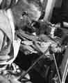 Albert Clayton preparing a pearl handle for a blade at William Gillott and Sons, pearl cutters, Pearl Works, Nos.17-21 Eyre Lane 