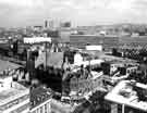 View: s44013 View of the City Centre showing (top) Hyde Park, Park Hill Flats and the Owen Building, Sheffield Polytechnic (bottom) Pinstone Street and No.105 Roy Peters (Menswear) Ltd., No.107 A. Myers Ltd., opticians, John Temple Ltd., tailors and Henry Kay