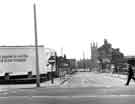 View: s44145 Eric H.Sims Ltd., motor coach proprieters, No.16 Ellin Street showing (back) St. Mary C. of E. Church, Bramall Lane