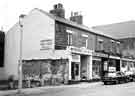 View: s44174 Shops on Broomhall Street at the junction of Hanover Square showing (l.to r.) No.207 Broomhall Sale Room, used furniture dealers, No.209 Jonathan Maw and Son, boot makers and No. 211 G.Fyne, fancy goods merchants