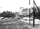 View: s44226 Clarence Street looking towards junction with Ecclesall Road showing (left) Curtis (Plumbers) Ltd., plumbers and glaziers, No.165 and (centre) The Arcade, Sheffield and Ecclesall Co-operative Society, Nos.21-41 Ecclesall Road