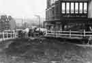 View: s44292 Roadworks on Angel Street showing Horne Brothers Ltd., gentlemans outfitters, Nos.1-3 King Street