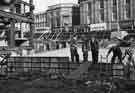 View: s44307 High Street and the construction of Castle Square showing (l.to r.) Nos.35-37 England's Smart Shoes Ltd., No.41 John Collier (Prices Tailors Ltd), tailors, No. 43 Swears and Wells Ltd., furriers