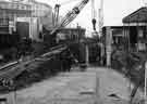 View: s44320 Construction of new subway in Castle Square showing (centre) the City Fuel Office and (right) 