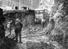 View: s44350 Construction of Castle Square showing (left) J. Walsh and Co., department store, High Street