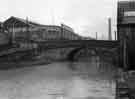 View: s44381 Bacon Lane canal bridge showing (top left) the Titanic Steel Co. Ltd.