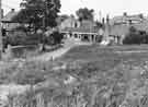 View: s44503 Tannery Close looking towards Cross Street, Woodhouse showing (centre) Market Cross and W.Dickinson, hardware shop