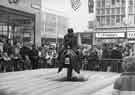 View: s44579 Fairground attraction on Holy Green showing (centre) shops on the Moor, No.88 Lloyds Bank Ltd., and No.85 Curry's Ltd., radio and television dealers