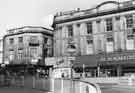 View: s44619 Shops on High Street showing (r.to l.) No.45 H. Samuel Ltd., jewellers, No. 43 Leeds Permanent Building Society, No.41 Crash Clothes and Nos. 35-37 Virgin Records. Also showing (centre) is the entrance to High Court