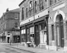 View: s44651 Devonshire Street showing (left) No.150 Mr. Kites Celebrated Wine Bar and Bistro Restaurant at the junction with Broomhall Street and (centre) Sheffield Combined Charities shop