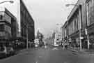 View: s44668 Shops on The Moor showing (left)  Nos.16-18 Dixons, photographic equipment, audio visual and electronics store and Debenhams, department store