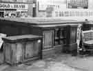 View: s44681 Fitzalan Square showing (l.to r.) the former premises of the Bell Hotel, No. 9 Coral, bookmakers and No. 11 Henry Wigfall and Son Ltd., television dealers (now demolished)