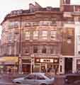 View: s44703 Junction of (left) Pinstone Street and Barkers Pool showing (l. to r.) Timpsons, shoe shop, Nos.2-6 Pinstone Street, Town Hall Chambers, No.1 Barkers Pool and GT News, No.3 Barkers Pool