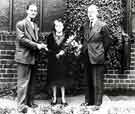 View: s45569 Retirement presentation to (centre) Mrs Lilian Bussindale by (right) Mr. G. M. and (left) Mr. D. G. Flather, W. T. Flather Ltd., Bright Steels, Sheffield Road, Tinsley