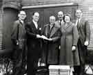 View: s45578 Retirement presentation to (centre) Mr Harry Lee by (second left) Mr. D. G. Flather, W. T. Flather Ltd., Bright Steels, Sheffield Road, Tinsley