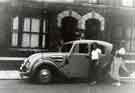 View: s45802 Mr and Mrs Allsop with their Singer car outside an unidentified location.