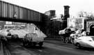 View: t06906 London Road railway bridge showing (left) H. Ponsford Ltd, furniture dealers, Nos.577-609 London Road, Heeley