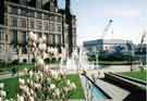 View: t09449 Fountains in the Peace Gardens showing (left) the Town Hall and (centre) the construction of the Winter Garden