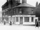 Albion Hotel (latterly the Mill Tavern public house), Nos. 2-4 Earsham Street showing (left) John Heath and Sons, funeral directors, c.1930