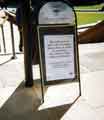 View: t10649 Sandwich board at the entrance to the Peace Gardens advertising a '3 minute silence' to remember the victims of the '9/11' terrorist attack in the USA