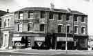 View: t11239 Doorway of Burngreave Library (left) and R. Mattock and Sons, butchers, No. 5 Ellesmere Road at Junction with (left) Gower Street