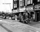 View: u07116 No. 451 Gowers and Burgons, grocers; No. 453 Manfield and Sons Ltd., shoe shop; No. 455 Chocolate Cabin, sweets and cigarettes and No. 457 ., carpet dealers, Firth Park Road