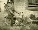 View: u08257 Unidentified man on a motor bike.