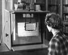 View: u08628 User consulting a micro-film reader in the Local Studies Library, Central Library, Surrey Street