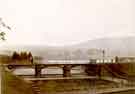 View: u10388 Footbridge at Agden Reservoir overflow with Sunnyside Farm centre right.