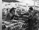 View: u10454 Fabric stall in Sheaf Market showing C. Hoyland, fruiterer (background) 