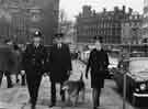 View: u10483 Policeman and policewoman with police dog handler on Church Street