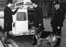 View: u10486 Policemen and policewoman with dog handler on Church Street